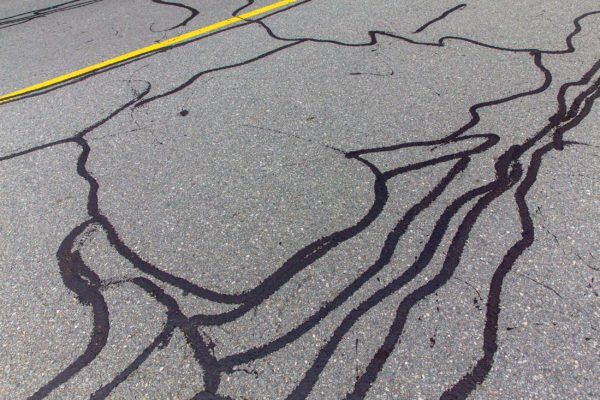 Cracks once filled this driveway. But they're sealed right away so water won't be able to permeate the surface and avoid issues.